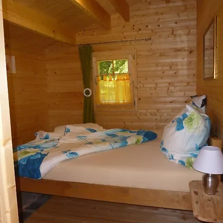 Holz-blockhaus Fuer Vier Personen Mit Terrasse Und Komplett Eingezaeuntem Grundstueck